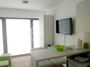 TV a/nebo společenská místnost v ubytování Apartman NINA Wind Resort