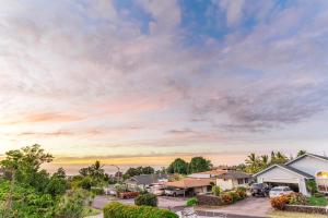 an aerial view of a house with a parking lot at Kona Paradise in Kailua-Kona