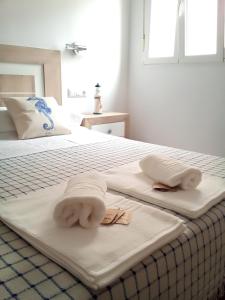A bed or beds in a room at Casa María