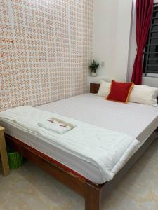 Postel nebo postele na pokoji v ubytování โรงแรมฮั่นฟาด 9 - Hostel Hạnh Phát 9