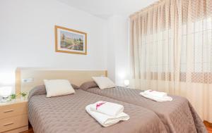Posteľ alebo postele v izbe v ubytovaní Apart-rent Apartament Av Rhode 2006