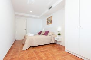 Posteľ alebo postele v izbe v ubytovaní Apart-rent Apartament Av Rhode 2006 + 28 fotografií