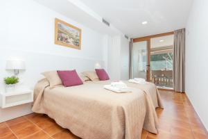 Posteľ alebo postele v izbe v ubytovaní Apart-rent Apartament Av Rhode 2006