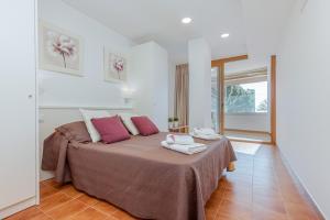 Posteľ alebo postele v izbe v ubytovaní Apart-rent Apartament Av Rhode 2006