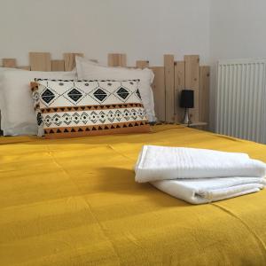 En eller flere senge i et værelse på Les Trois Temps