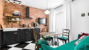 Kuchyňa alebo kuchynka v ubytovaní Comfy Apartments - Stare Miasto z Ogrodem
