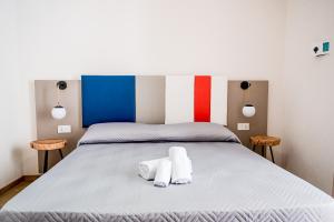 Posteľ alebo postele v izbe v ubytovaní Incao Holiday Giudecca House