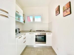 Η κουζίνα ή μικρή κουζίνα στο Appartamento Buresso