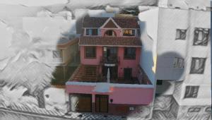 a large pink house with snow on the ground at La Casona Canaria Boutique Home B & B in Agüimes