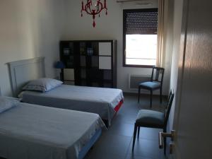 Ένα ή περισσότερα κρεβάτια σε δωμάτιο στο LE CARRE MONTFORT