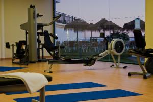 a gym with exercise equipment and a view of the ocean at Cerro Mar Atlantico & Cerro Mar Garden in Albufeira