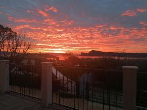 The sunrise or sunset as seen from a panziókat or nearby