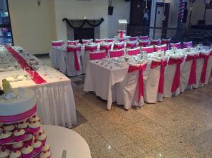 a row of tables with red and white table settings at Eagle Heights Mountain Resort in Eagle Heights