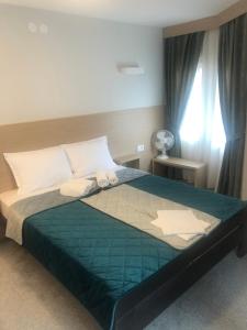 Katil atau katil-katil dalam bilik di Garni hotel Vir