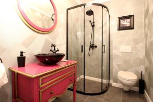 a bathroom with a sink and a glass shower at Casa Hermanni in Sibiu +74 photos