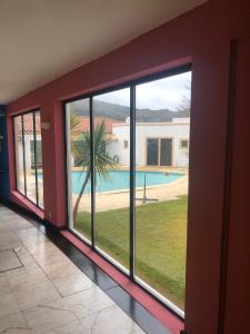 a room with a window with a view of a pool at Hotel Castelo de Vide in Castelo de Vide