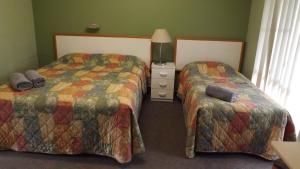 Cama ou camas em um quarto em Collie Motel