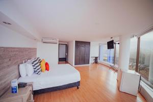 Voodi või voodid majutusasutuse Hotel Metropolis Plaza Cali toas