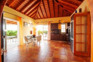 a kitchen and dining room with a table and chairs at Villa Tamanca in El Paso