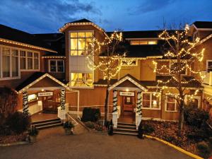 a house with a large window and a large building at Hotel Eldorado at Eldorado Resort in Kelowna