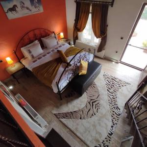 a bedroom with a large bed and a rug at Ipekyolu Garden in Avanos