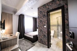 Voodi või voodid majutusasutuse Garnet Hotel & Event Centar toas