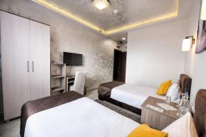 Voodi või voodid majutusasutuse Garnet Hotel & Event Centar toas