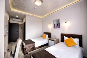 Voodi või voodid majutusasutuse Garnet Hotel & Event Centar toas
