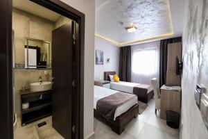 Voodi või voodid majutusasutuse Garnet Hotel & Event Centar toas