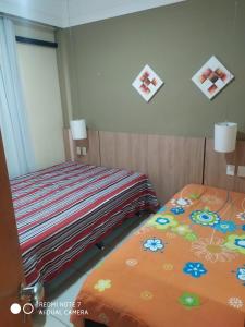 Un pat sau paturi într-o cameră la Aldeia das águas Park Resort - Flat Quartier