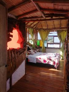 a bedroom with two beds in a room at Cabañas Guacari San Agustín huila in San Agustín