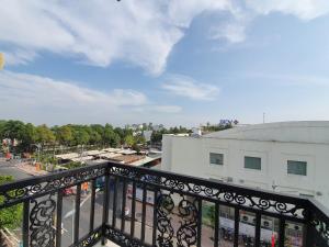 a view of a city from a balcony at Minh Khue Hotel in Vĩnh Long