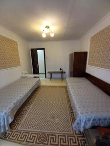 Кровать или кровати в номере Apartment on Lenina 55