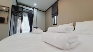 Postel nebo postele na pokoji v ubytování Sabua The Terrace Homestay