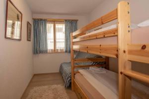 Postel nebo postele na pokoji v ubytování Ferienwohnung Gartenweg