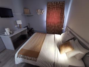 Кровать или кровати в номере Hotel Ambotel