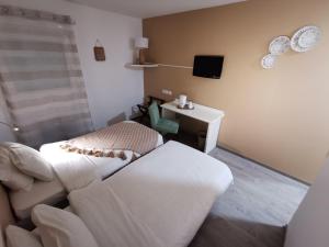 Postel nebo postele na pokoji v ubytování Hotel Ambotel