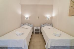 Letto o letti in una camera di Amaryllis Hotel