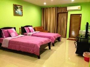 En eller flere senge i et værelse på Penang Palace