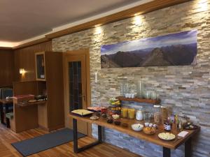 a room with a table with food on it at Pension Bavaria in Mittenwald