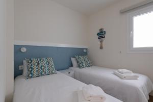 Posteľ alebo postele v izbe v ubytovaní Elegant living with great views of Las Canteras Beach