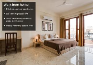 een slaapkamer met een bed en een groot raam bij Hostie Eva Dreams - Private 2 BHK Apartments near Artemis, Medanta, Fortis hospitals in Gurgaon