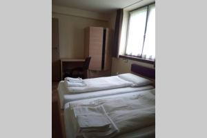 A bed or beds in a room at Chalet Maso Fradea Family Resort