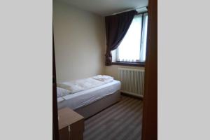 A bed or beds in a room at Chalet Maso Fradea Family Resort