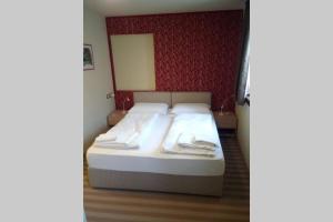 A bed or beds in a room at Chalet Maso Fradea Family Resort