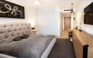 Televízia a/alebo spoločenská miestnosť v ubytovaní Apartament SEASIDE parking w cenie