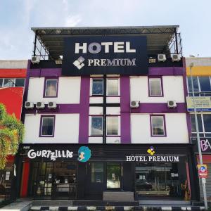 a hotel with a sign on the front of it at HOTEL PREMIUM in Ipoh