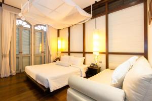 Cama ou camas em um quarto em The Memory at On On Hotel