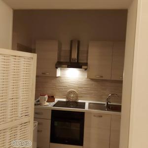 a kitchen with a sink and a stove top oven at Dimora Dei Gelsi in Polignano a Mare +49 photos