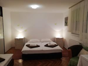 Ein Bett oder Betten in einem Zimmer der Unterkunft Guesthouse Arnika